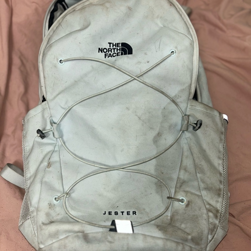 The North Face White Backpack with Padded Straps and Durable Design